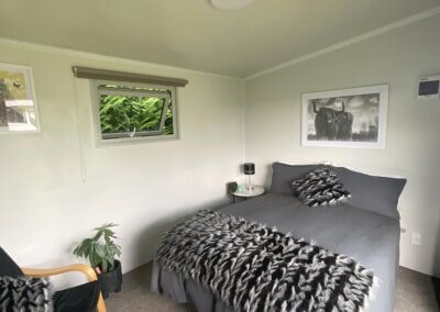 Fully furnished cabin interior with double bed